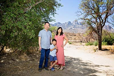 Dr. Jeannie Ju and Dr. Sung Ju with their child