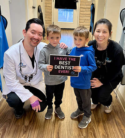 the dentists at Creative Smiles posing with pediatric patients